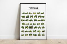 a poster with tractors on it in front of a white wall and wood flooring