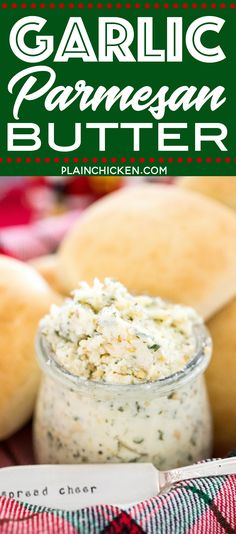 garlic parmesan butter in a glass jar with bread rolls behind it on a red and white checkered cloth