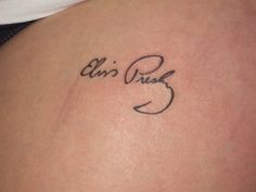 the back of a woman's stomach with an inscription on it