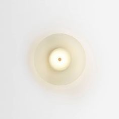 an overhead view of a light fixture on a white wall