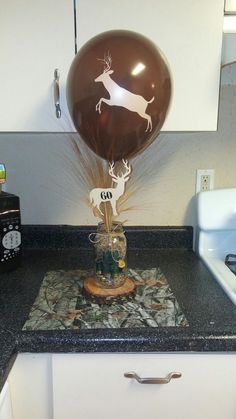 a balloon with a deer on it sitting on top of a counter