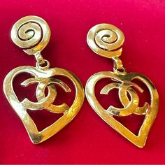 Stunning Earrings From Chanel. Spring 1995. Large Scale. Gold Hearts With The Interlocking Cc Logo. Swirl Top Design. Earrings Measure 2.9 Inches Long By 1.5 Inches Wide. Snug Clip Backs. Excellent Condition. The Gold Plate Is Beautifully Polished. Chanel Double C Earrings, Chanel Spring 1995, Chanel Earrings Cc, Chanel Large Cc Earrings, Gold Chanel Earrings, Chanel Logo Earrings, Gold Hearts, Chanel Jewelry, Chanel Spring