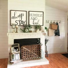 An empty white brick fireplace accents this white shiplap living room with warm wood floors. A large tobacco basket leans against the fireplace on the lower mantle next to a glass vase of eucalyptus and a wood two-tier easel with farmhouse decor...   Image: theturquoisefarmhouse