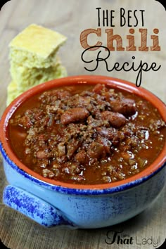 chili recipe in a blue bowl with bread on the side and text overlay that reads chili recipe