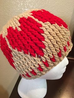 a knitted hat on top of a mannequin head