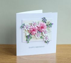 a birthday card with pink flowers on it