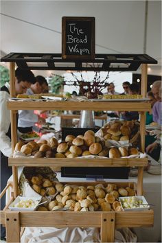 breads and pastries on display at an outdoor market