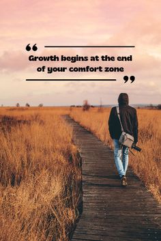 a person walking down a wooden walkway with a quote about growth begins at the end of your comfort zone