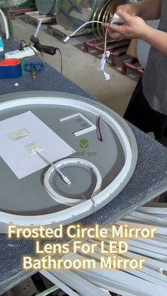 an image of a bathroom mirror being worked on