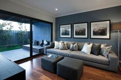 a living room filled with furniture next to a sliding glass door