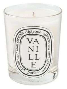 a candle that is sitting in front of a white background with the words vanilla on it