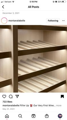 an instagramted photo of a wooden shelving unit with white shelves and lights