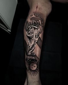 a man's leg with a tattoo on it