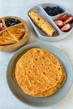 there are three different types of food on this plate, one is tortilla and the other is fruit