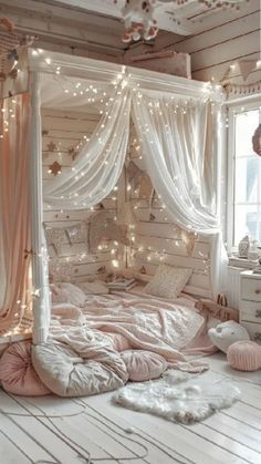 a white bed sitting in a bedroom next to a window with lights on the ceiling