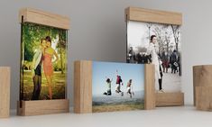 three wooden frames displaying photos of people in the park, and one is holding a skateboard