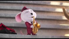 a stuffed animal is playing the saxophone on some steps