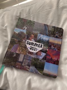 a book that is laying on top of a white sheet with pictures and words in it