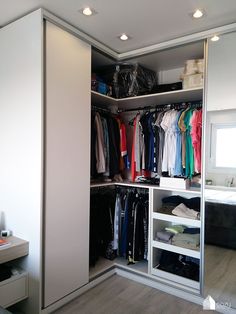 the closet is full of clothes and other items