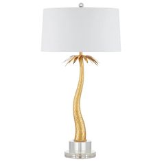 a table lamp with a white shade on the top and a gold leaf design on the bottom