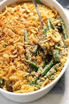 a white bowl filled with green bean casserole