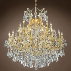 a chandelier with many lights hanging from it's sides and lots of crystal drops