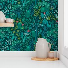 a green wallpaper with plants and birds in the forest, on a white countertop