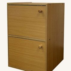 a wooden file cabinet with two drawers