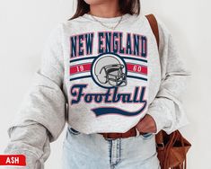 WELCOME TO MY STORE ♥️ This New England Patriot, New England Football Sweatshirt, The Pats Shirt, Vintage New England Crewneck, Patriots Sweatshirt, New England Fan Gift, Patriots Football, Patriots Sweatshirt, Homeland Defense, Sunday Football, Game Day Shirt, Football Lovers, Gift for her, Gift for him, Sports Gift, American Football , Super Bowl Shirt, Christmas Gifts. *Please check Color and Size Charts before placing the order. You can find them in the listing's photos (Depending on what de England Fans, Football Sunday, Patriots Football, England Football, Football Sweatshirt, Game Day Shirts, Selling Clothes, Vintage Sweatshirt, American Football