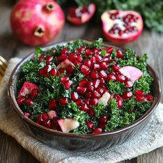 pomegranate and kale in a bowl on a table