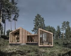 a small wooden cabin in the middle of a forest with lots of trees around it