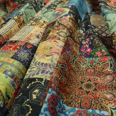 the colorful fabric has many different designs on it