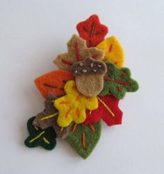 a bunch of felt flowers sitting on top of a table