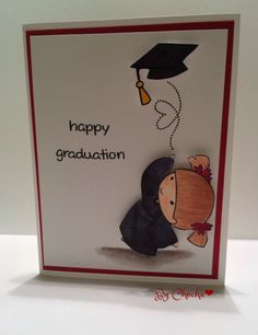 a handmade graduation card with a graduate's cap and gown holding a balloon