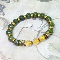 "Jade is well known as the stone of good luck, it the perfect gemstone to give to someone who is starting a new business or a new job. Paired with Citrine, the \"money stone,\" this prosperity bracelet is sure to help manifest financial opportunities. Both Citrine and Jade also encourage new beginnings, support well being and promote gratitude and joy. Jade is also believed to promote wisdom, balance, peace and harmony. It helps with dysfunctional relationships, self-loathing and improves self-c Prosperity Bracelet, Dysfunctional Relationships, Jade Gemstone, Citrine Beads, Les Chakras, Chunky Bracelets, Attract Money, Gemstone Beaded Bracelets, Citrine Crystal