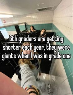 two girls in a bathroom with the caption 6th graders are getting shorter each year, they were giants when i was in grade one