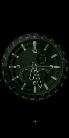 a black watch face with white numbers on the dial and second hand pointing to the hour