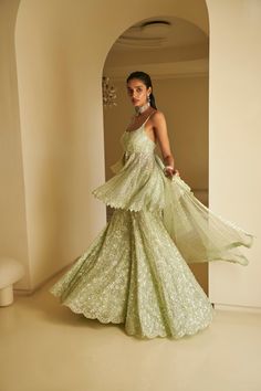 This sharara set features all-over delicate sequin embroidery on a mint green net base. The outfit is paired with a full embroidered peplum top and a matching dupatta.From Seema Gujral's Fiori - the sharara edit collection. DELIVERY TIMEPlease allow 8-12 weeks for your outfit to arrive. FABRIC DETAILSNet Professional cleaning only. Indo Western Mehendi Outfits, Green Indian Outfit, Sequin Sharara, Indian Wedding Guest Outfit, Green Sharara, Suits Ideas, Diwali Outfit, Peter Kavinsky