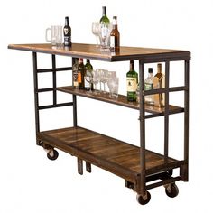 a bar cart with bottles and glasses on it