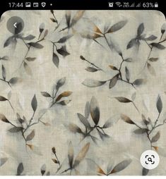 a white fabric with brown leaves on the back and side of it, in shades of grey