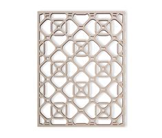 an intricate laser cutout in beige with geometric shapes on the outside and inside of it