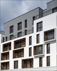 an apartment building with balconies and balconies on the side