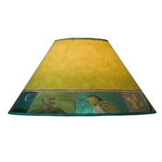 a green lamp shade with an image of a bird and flowers on the bottom side