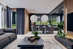 a living room filled with furniture and a flat screen tv on top of a wooden table