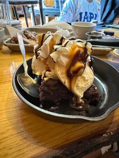 an ice cream sundae with chocolate sauce and caramel drizzle