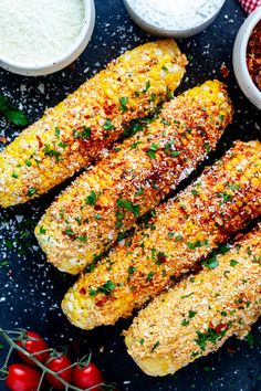 grilled corn on the cob with chili and parmesan cheese in bowls