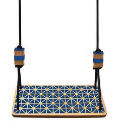 a wooden swing with blue and yellow geometric designs