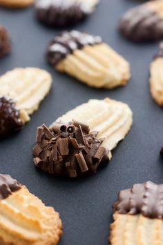 cookies with chocolate and marshmallows are arranged on a baking sheet