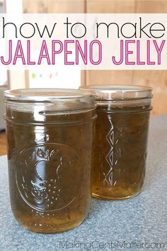 two jars filled with jalapeno jelly sitting on top of a countertop