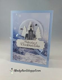 a christmas card with an image of a church in the background and a ribbon around it